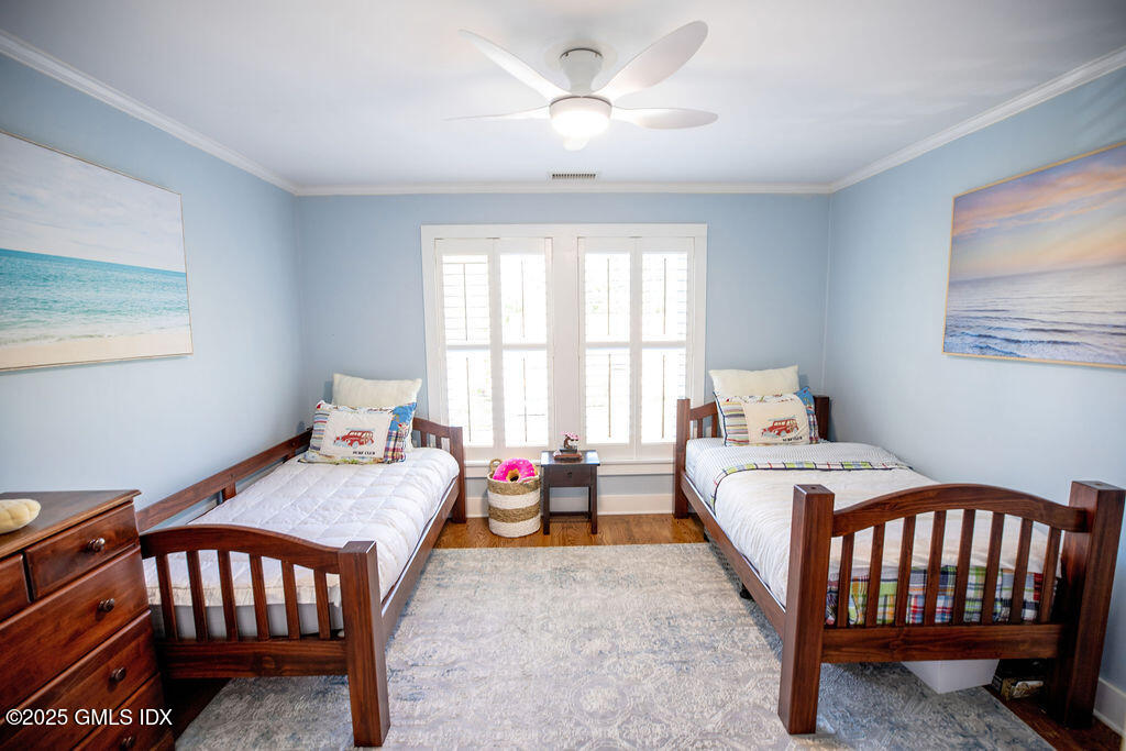 9 Center Road Old Greenwich, CT 06870 - Photo 17 of 26 a bedroom with furniture and a window