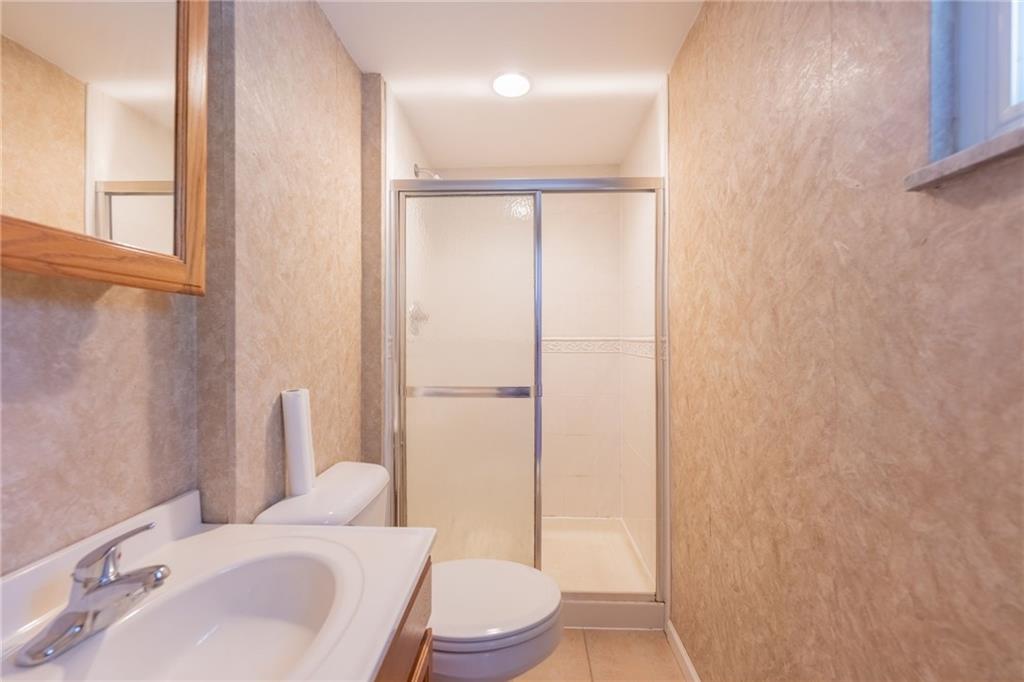 200 Foxcroft Road Pittsburgh, PA 15220 - Photo 27 of 43 a bathroom with a sink toilet and shower