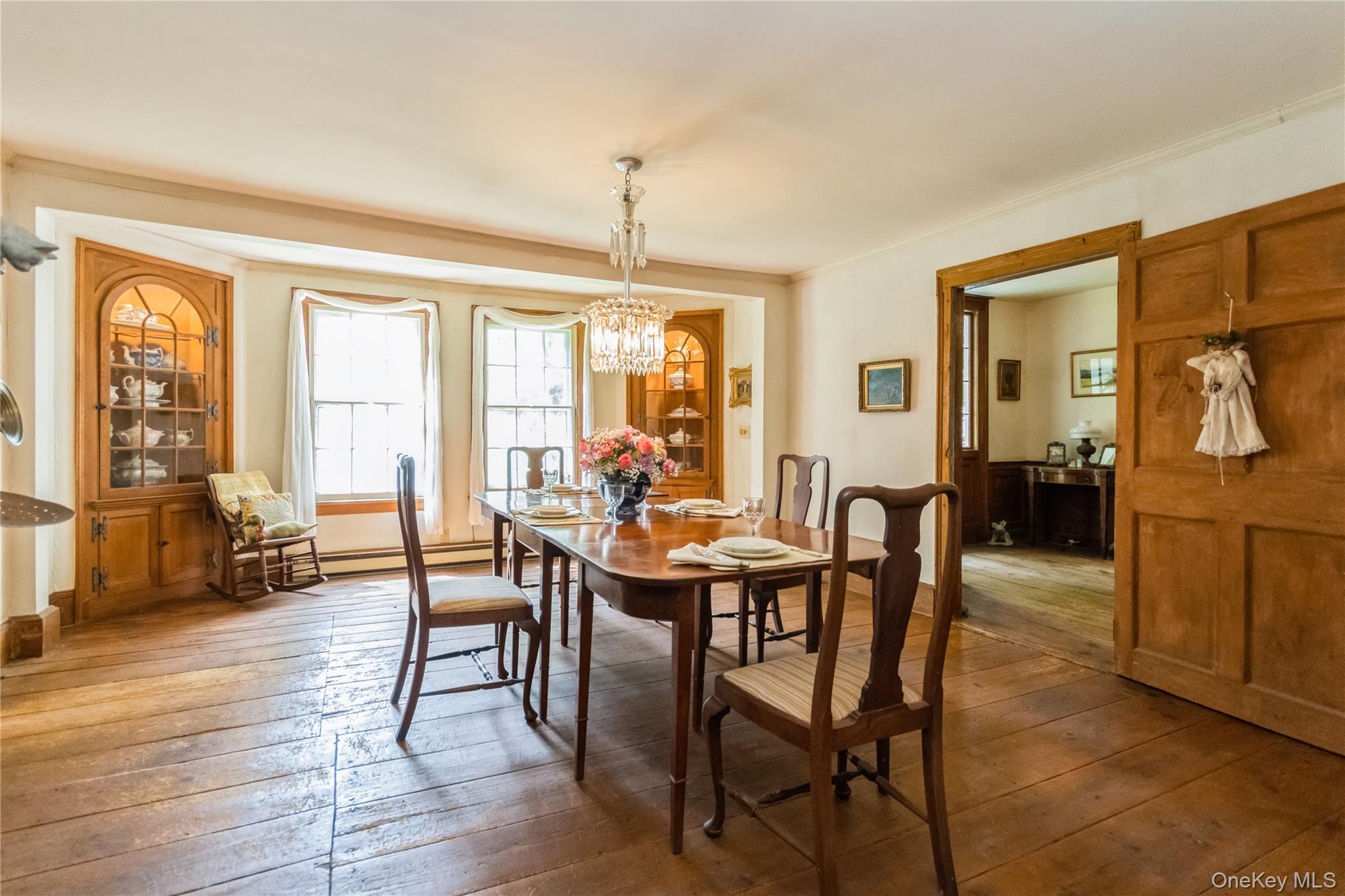93 Widmer Road Wappingers Falls, NY 12590 - Photo 12 of 45 Dining space with wide board flrs, chandelier, crown molding,, built in cabinets