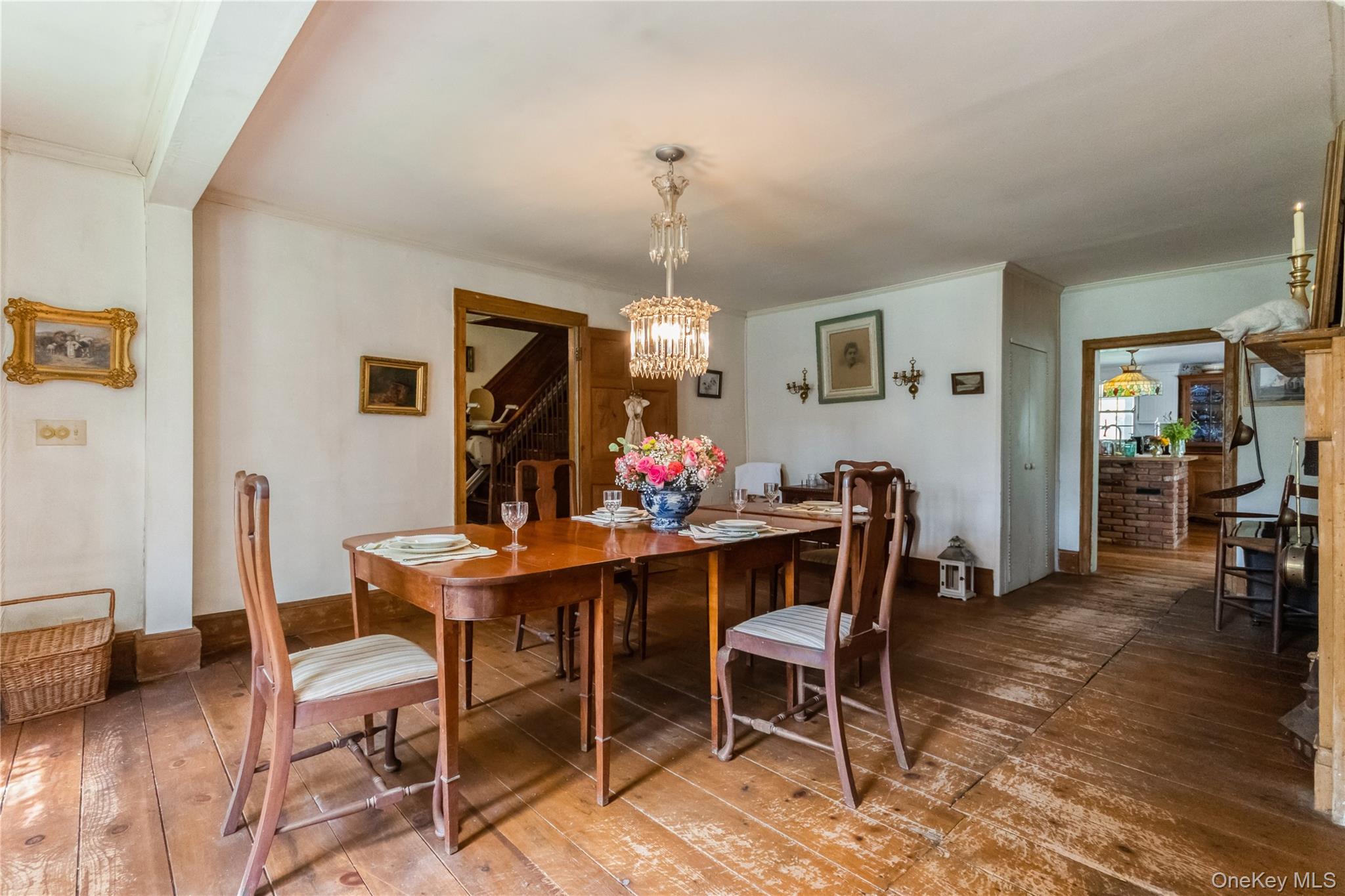 93 Widmer Road Wappingers Falls, NY 12590 - Photo 14 of 45 Dining room with a chandelier, wide board flrs.,entrance from kitchen