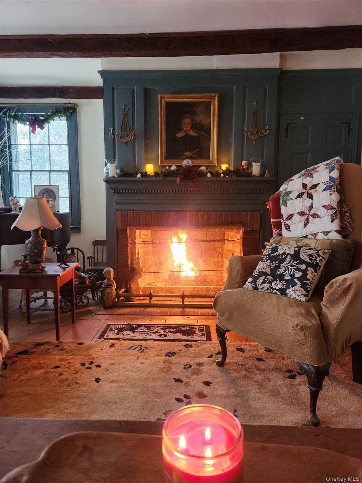 93 Widmer Road Wappingers Falls, NY 12590 - Photo 19 of 45 Living area with a brick fireplace lit for those cool nights.
