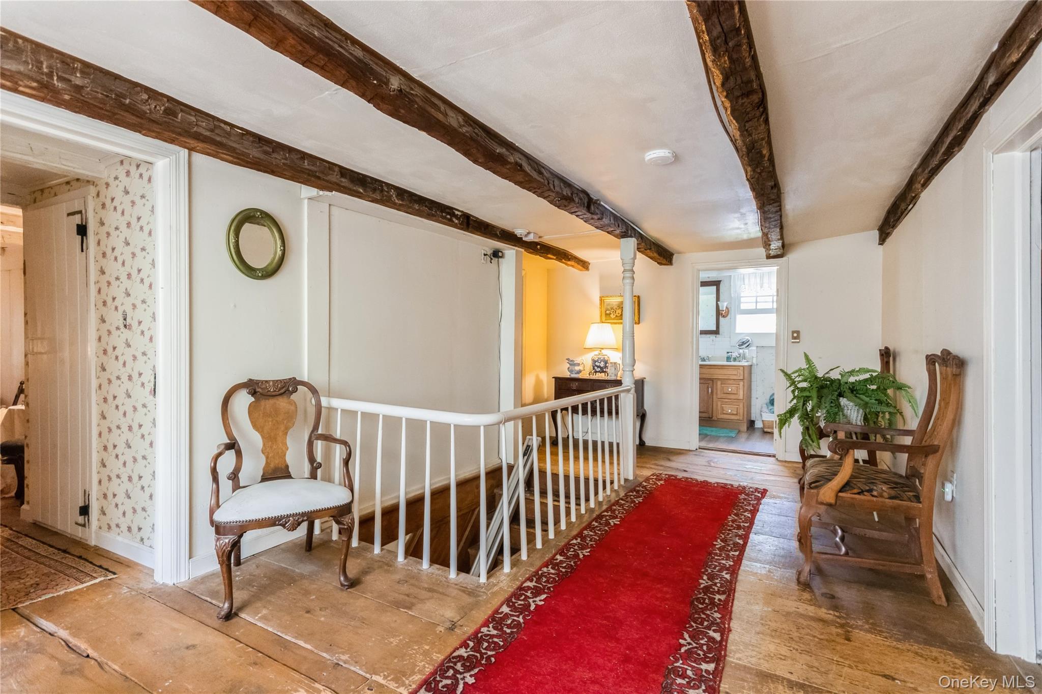93 Widmer Road Wappingers Falls, NY 12590 - Photo 26 of 45 Upstairs Hall with wood-type flooring and beam ceiling