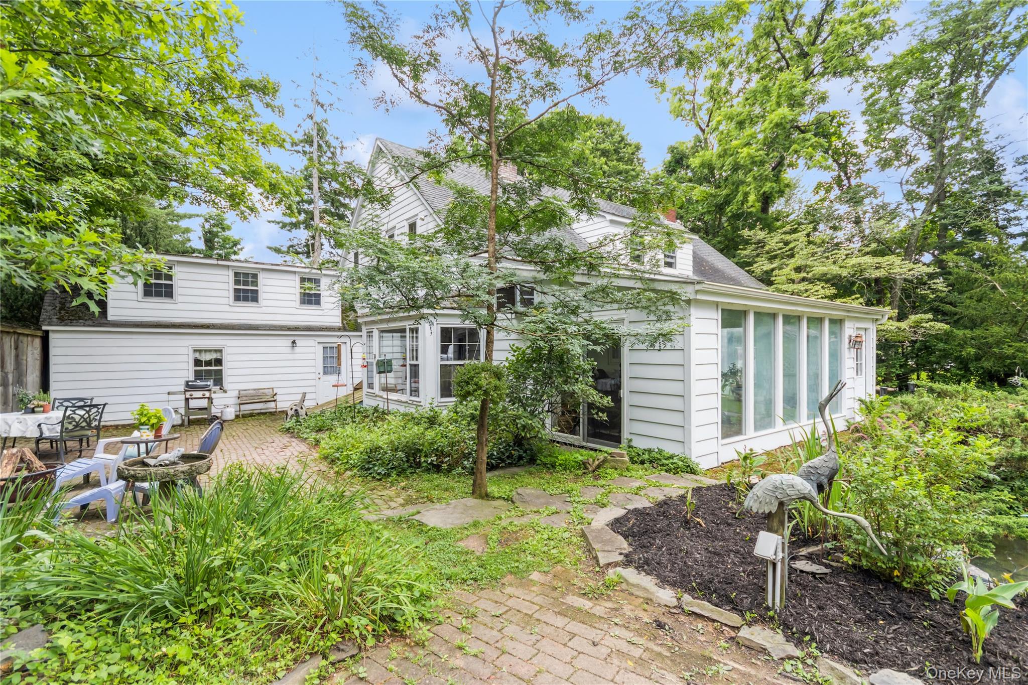 93 Widmer Road Wappingers Falls, NY 12590 - Photo 3 of 45 Side yard looking at patio, kitchen and sunroom