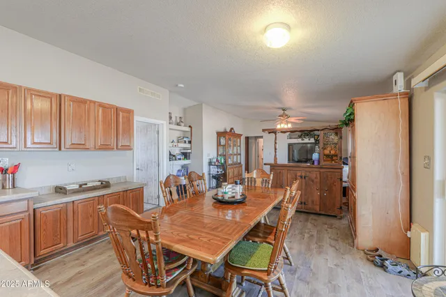 a en suite bathroom with a granite countertop sink and a mirror