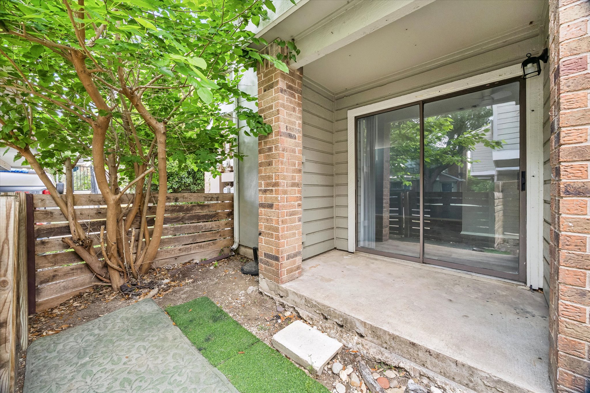 2018 West Rundberg Lane, Unit 13A Austin, TX 78758 - Photo 10 of 11 a view of a backyard with a large tree