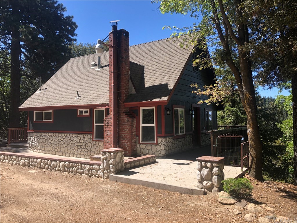 582 Sunset View Road Twin Peaks, CA 92391 - Photo 2 of 18 a front view of a house