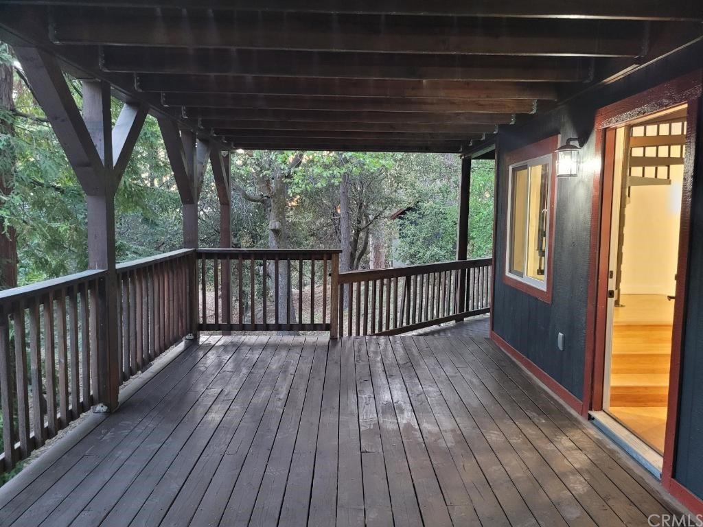 582 Sunset View Road Twin Peaks, CA 92391 - Photo 16 of 18 a view of backyard with wooden floor