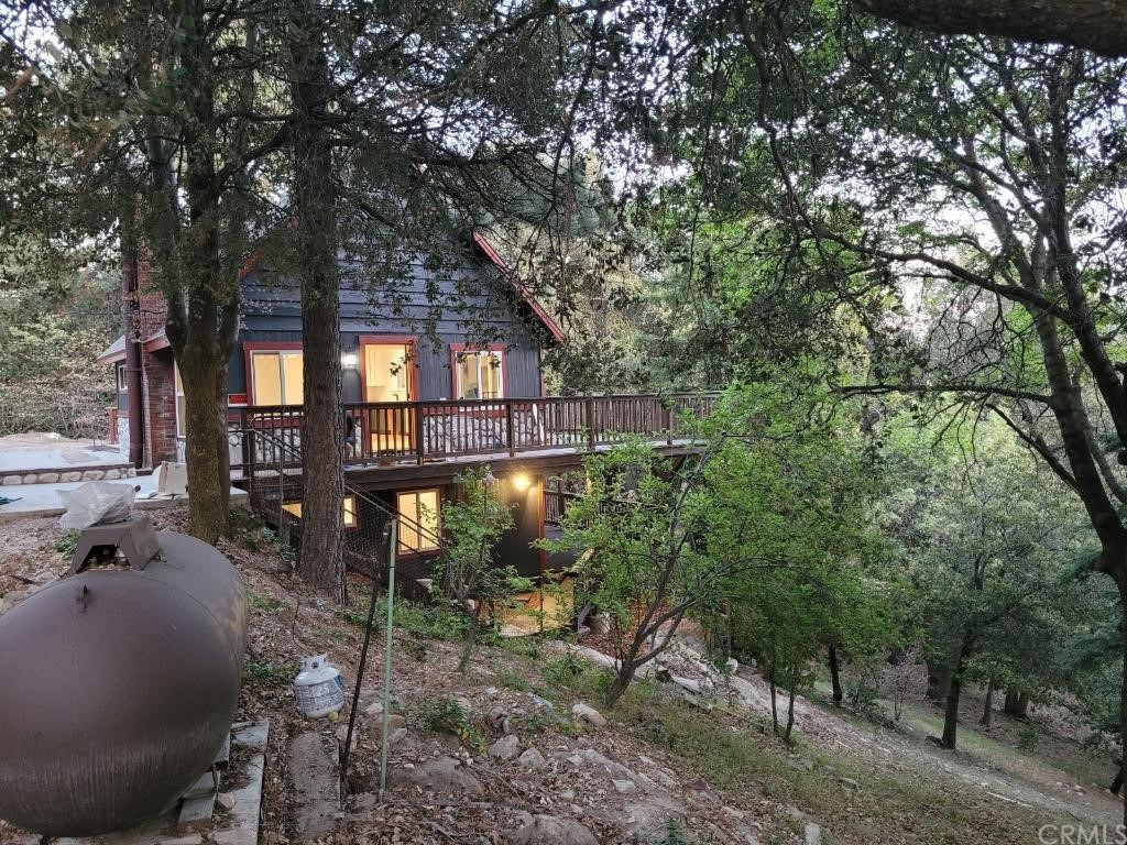 582 Sunset View Road Twin Peaks, CA 92391 - Photo 3 of 18 a front view of a house with a yard