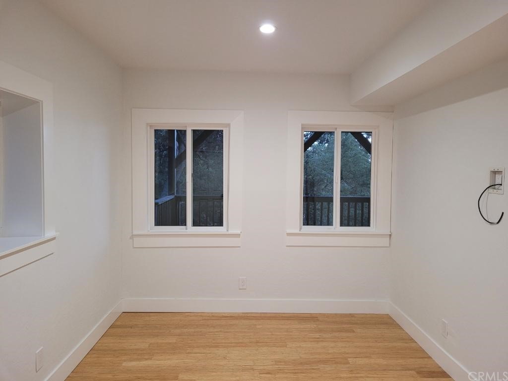 582 Sunset View Road Twin Peaks, CA 92391 - Photo 8 of 18 an empty room with a window