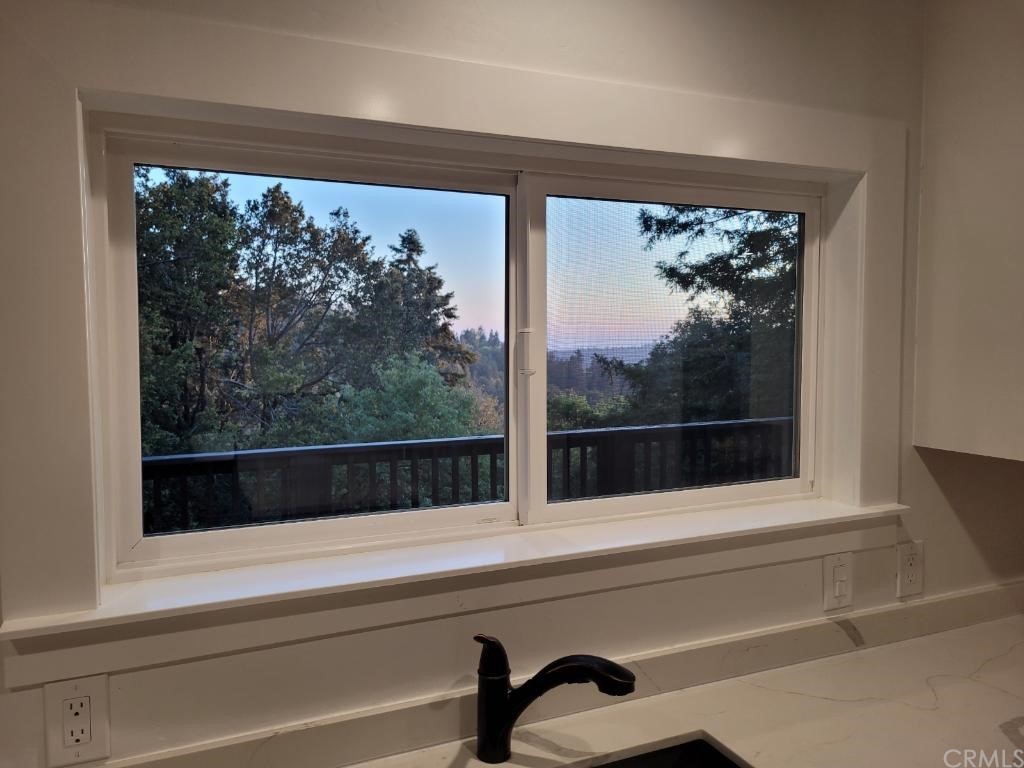 582 Sunset View Road Twin Peaks, CA 92391 - Photo 9 of 18 a view of a glass door and a window