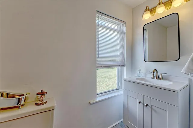 a view of a room with furniture and a ceiling fan