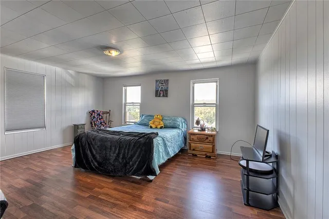 a bed room with bed and window