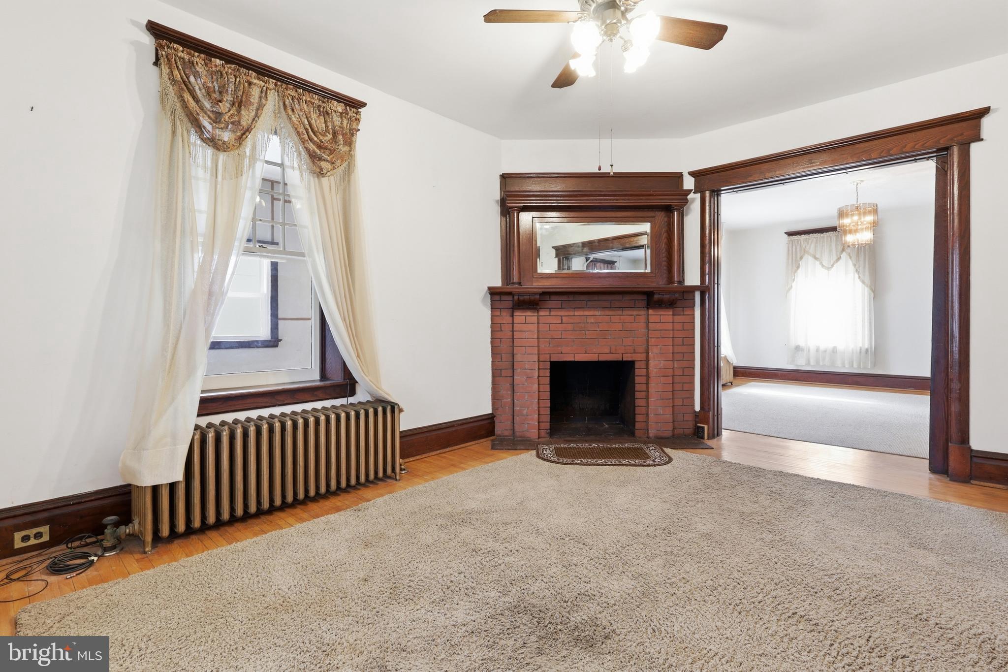 72 South Main Street Smithsburg, MD 21783 - Photo 11 of 48 a view of a livingroom with a fireplace and stairs