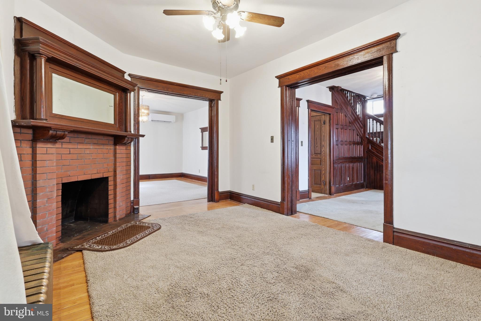 72 South Main Street Smithsburg, MD 21783 - Photo 12 of 48 a view of an empty room with chandelier fan and fire place
