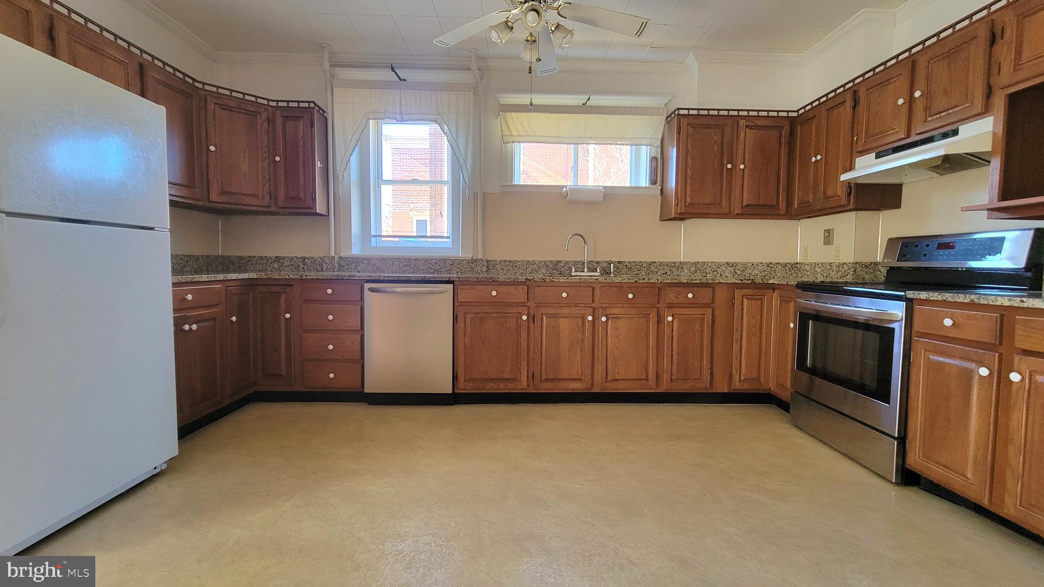 72 South Main Street Smithsburg, MD 21783 - Photo 14 of 48 a kitchen with granite countertop sink stainless steel appliances and cabinets