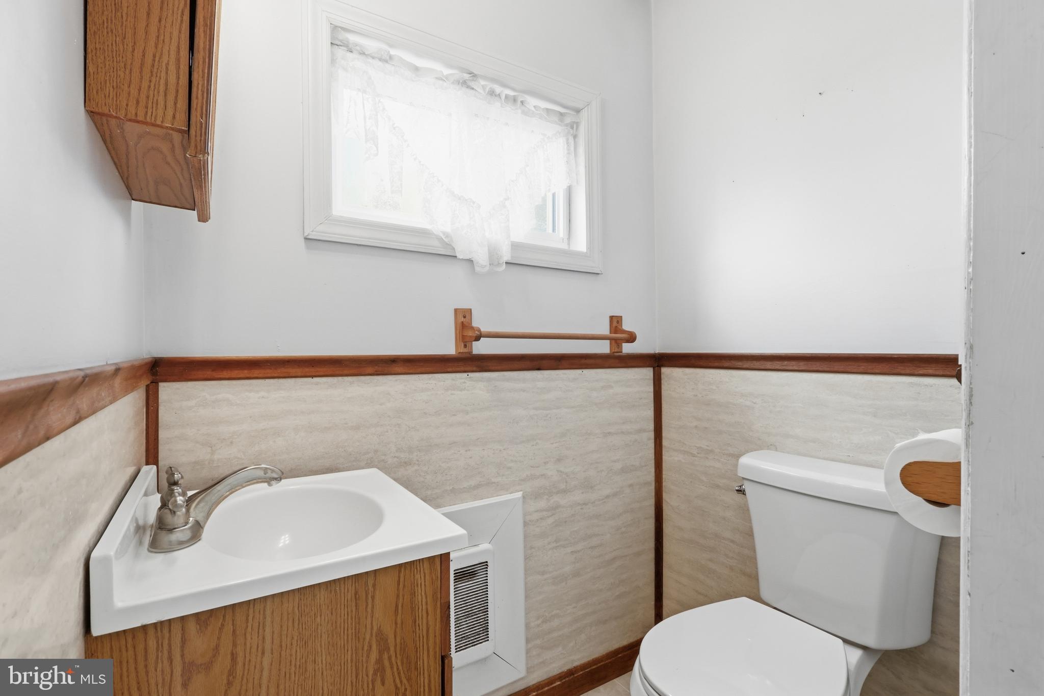 72 South Main Street Smithsburg, MD 21783 - Photo 21 of 48 a bathroom with a sink a toilet and mirror