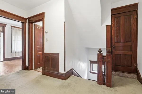 a view of empty room with wooden ceiling