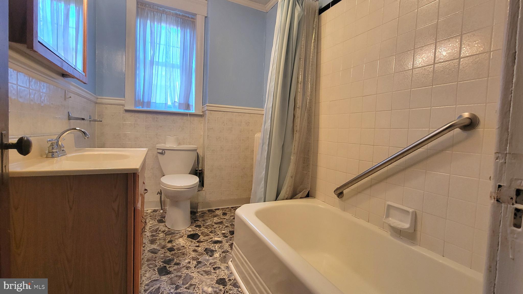 72 South Main Street Smithsburg, MD 21783 - Photo 27 of 48 a bathroom with a sink a toilet and tub