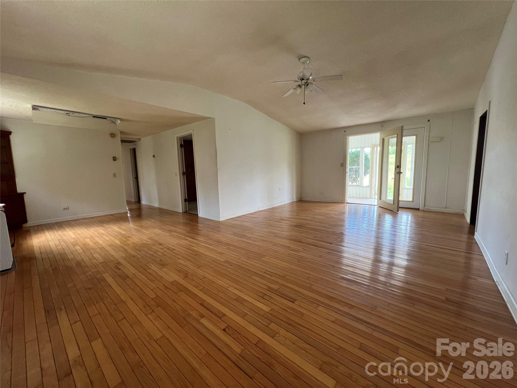 4405 Maple Creek Road Rutherfordton, NC 28139 - Photo 9 of 32 a view of an empty room with wooden floor and a window
