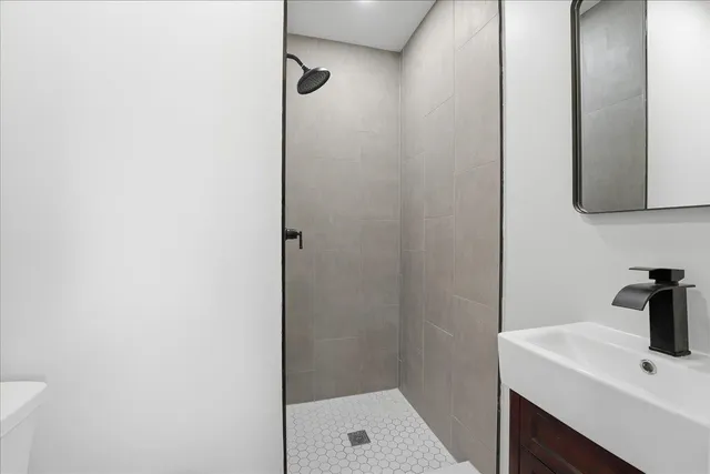 a bathroom with a sink and a shower