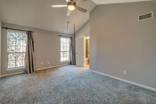 a bathroom with a bathtub and a toilet