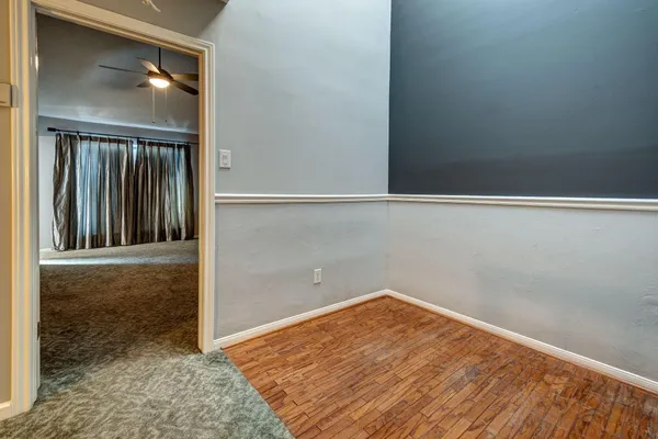 an empty room with windows and closet