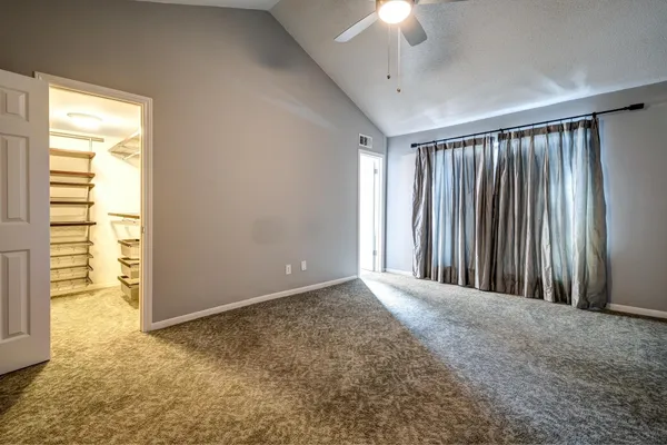 a bathroom with a granite countertop sink a toilet and bathtub