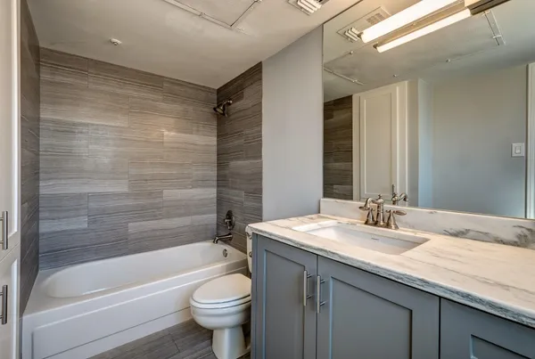 an empty room with an empty space and windows