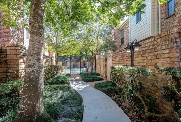 a view of a pathway both side of house