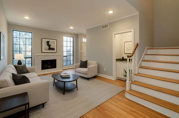 a living room with furniture and a fireplace