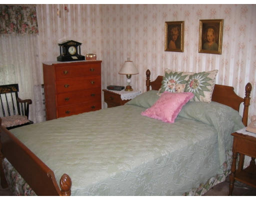 95 Winchester Road Arlington, MA 02474 - Photo 4 of 6 a bedroom with bed and mirror
