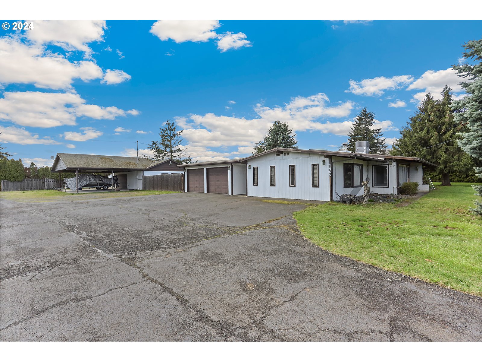 1465 Tucker Road Hood River, OR 97031 - Photo 2 of 48 a front view of a house with a garden