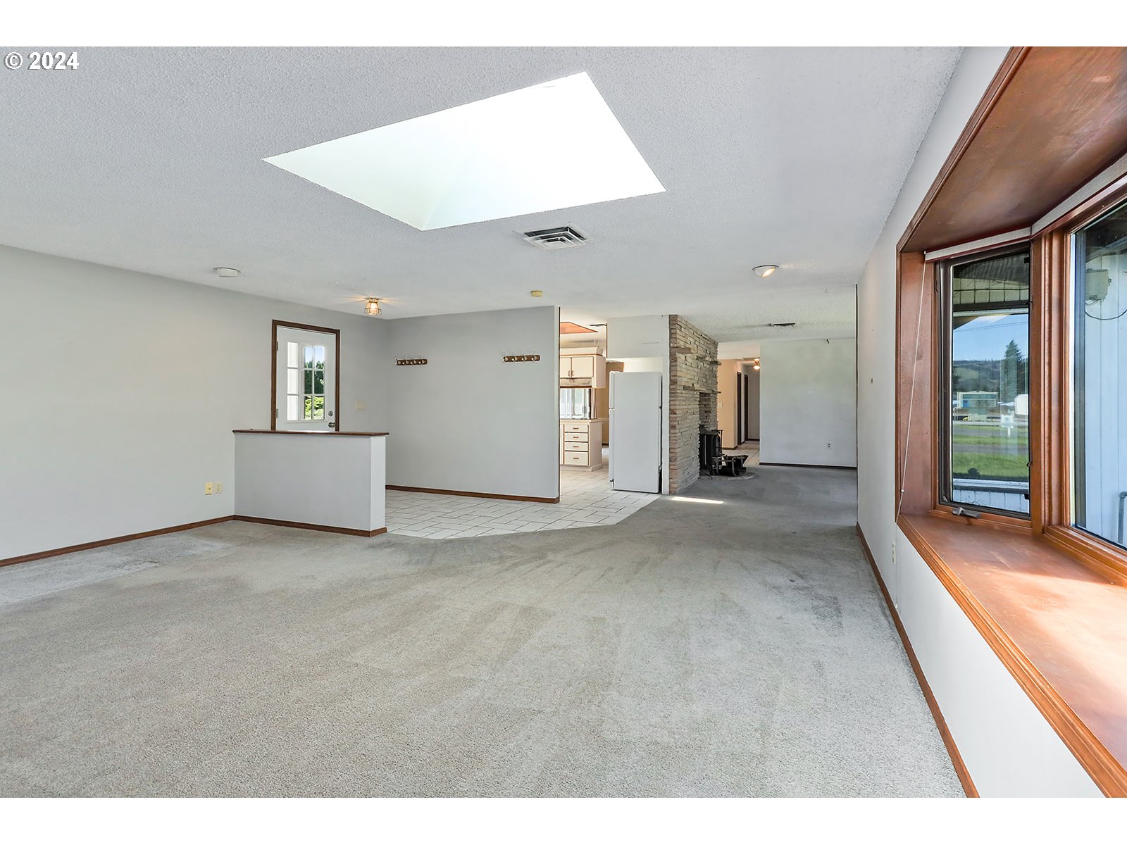 1465 Tucker Road Hood River, OR 97031 - Photo 26 of 48 a view of a big room with windows and chandelier