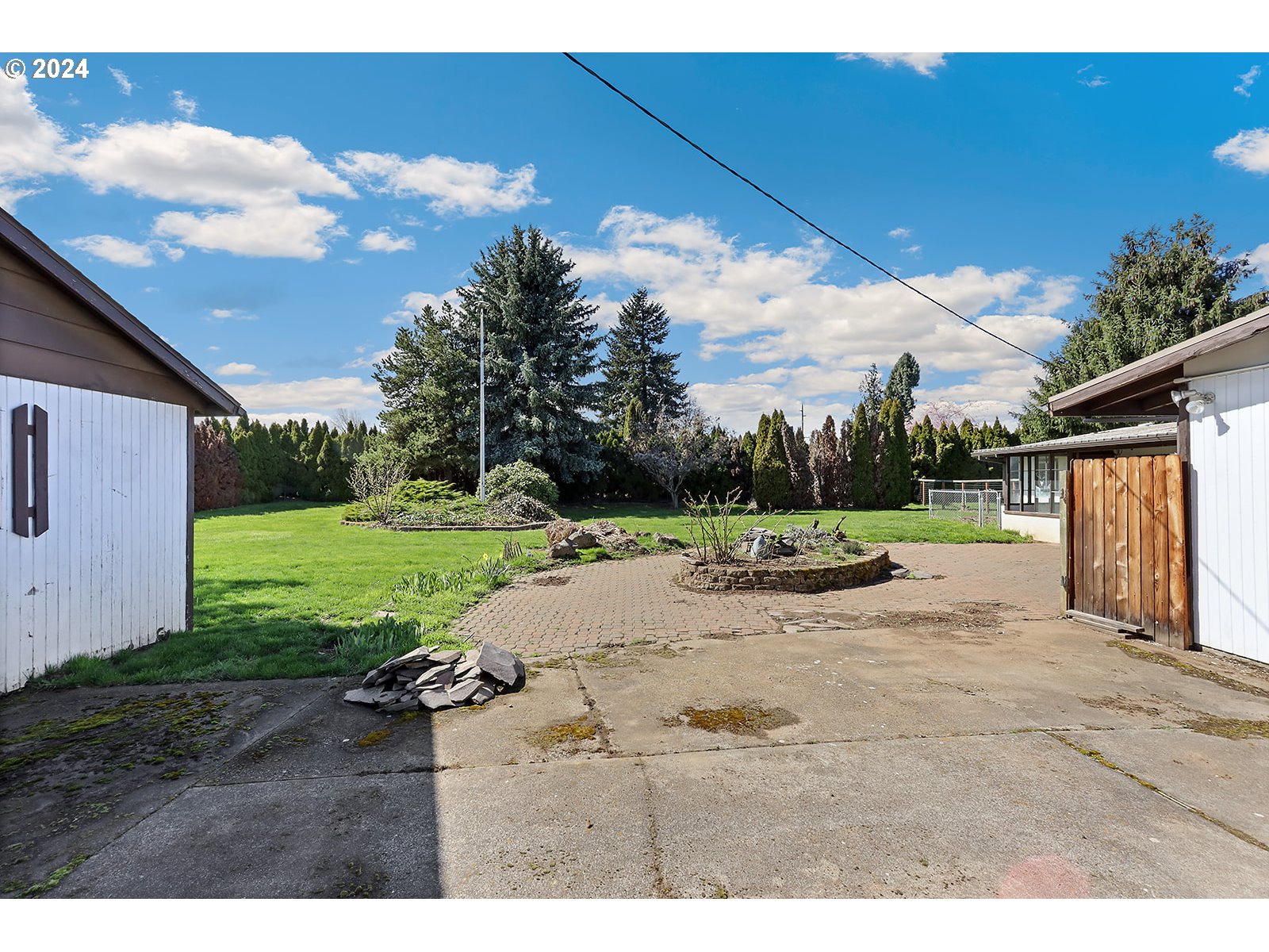 1465 Tucker Road Hood River, OR 97031 - Photo 30 of 48 a view of a dry yard with wooden fence