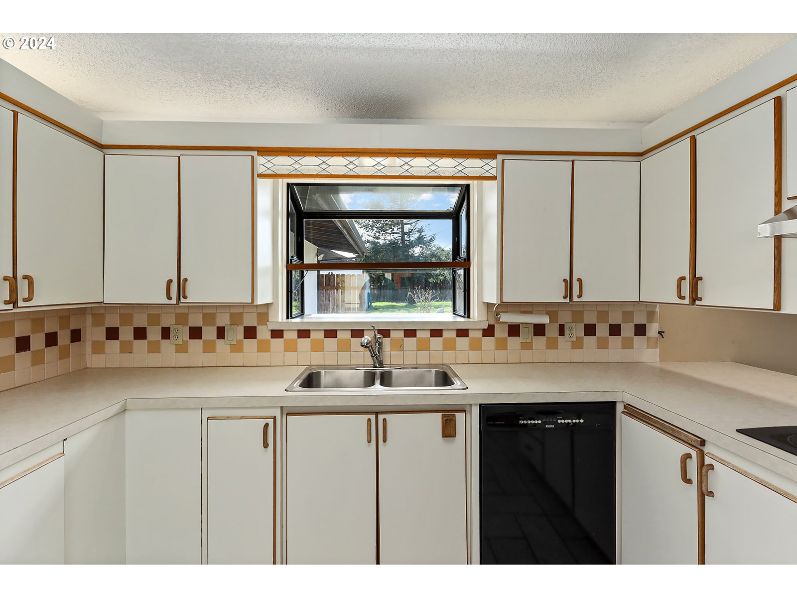 1465 Tucker Road Hood River, OR 97031 - Photo 5 of 48 a kitchen with a sink and a wooden cabinets