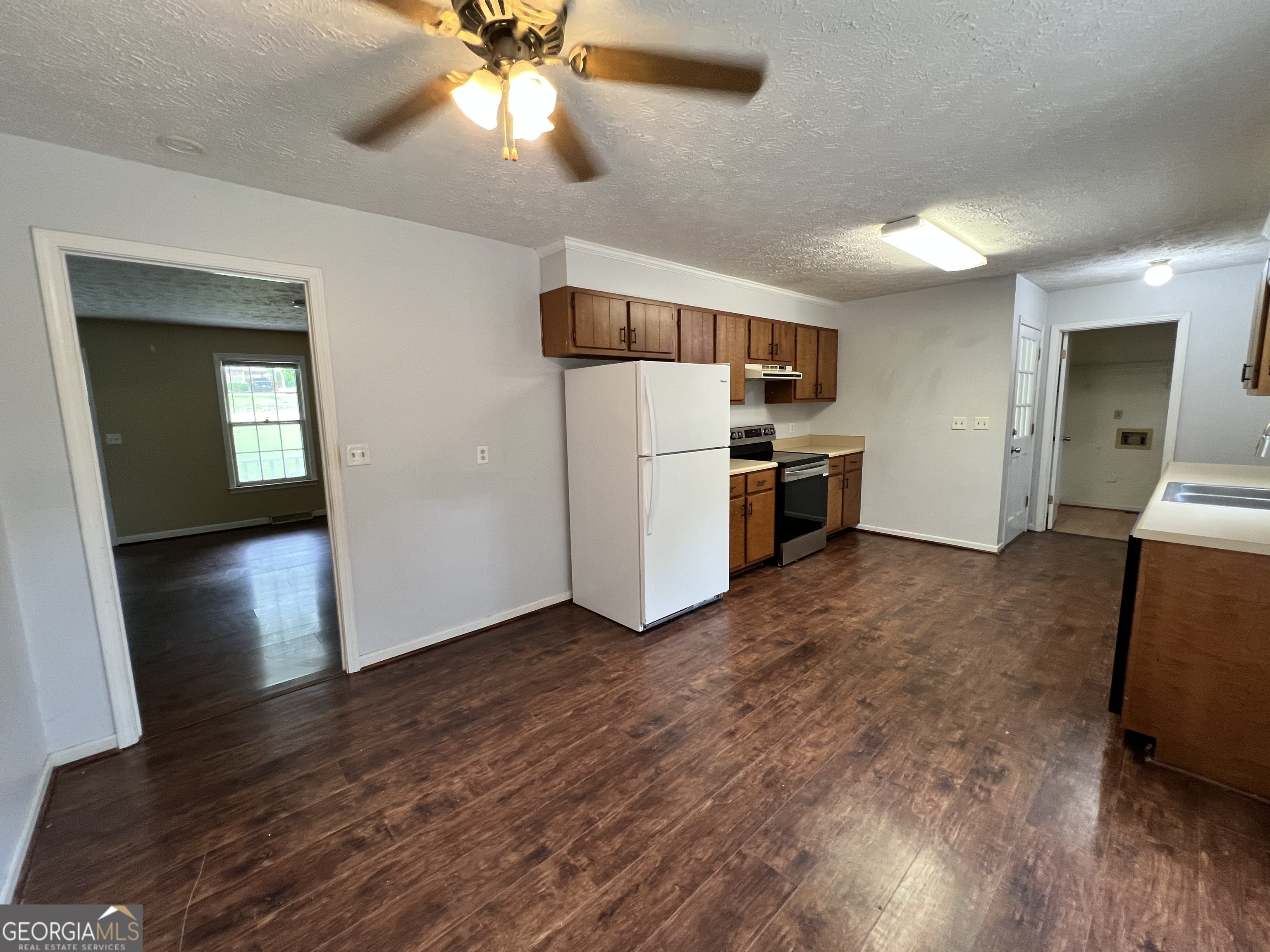 32 Ford Drive Southeast Rome, GA 30161 - Photo 8 of 49 a view of a kitchen with a sink oven cabinets and wooden floor