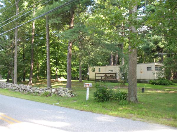 170 Wilsonville Road Thompson, CT 06255 - Photo 5 of 5 a backyard of a house with table and chairs