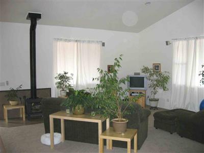 5450 Henning Road Sebastopol, CA 95472 - Photo 5 of 8 a living room with furniture potted plant and a window
