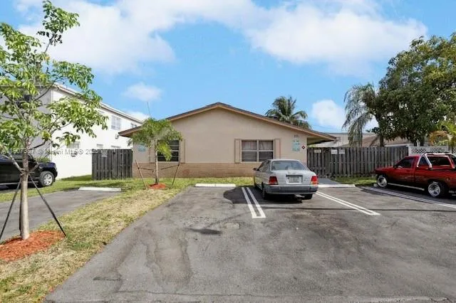 a view of a yard in front view of a house