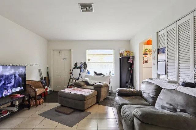 a kitchen with a sink a stove and cabinets