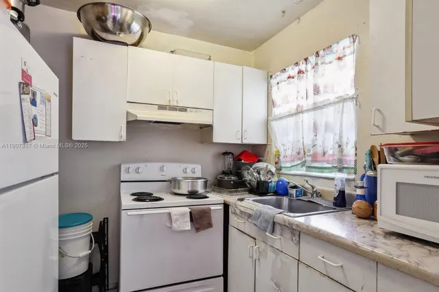 a bathroom with a sink toilet and a bathtub