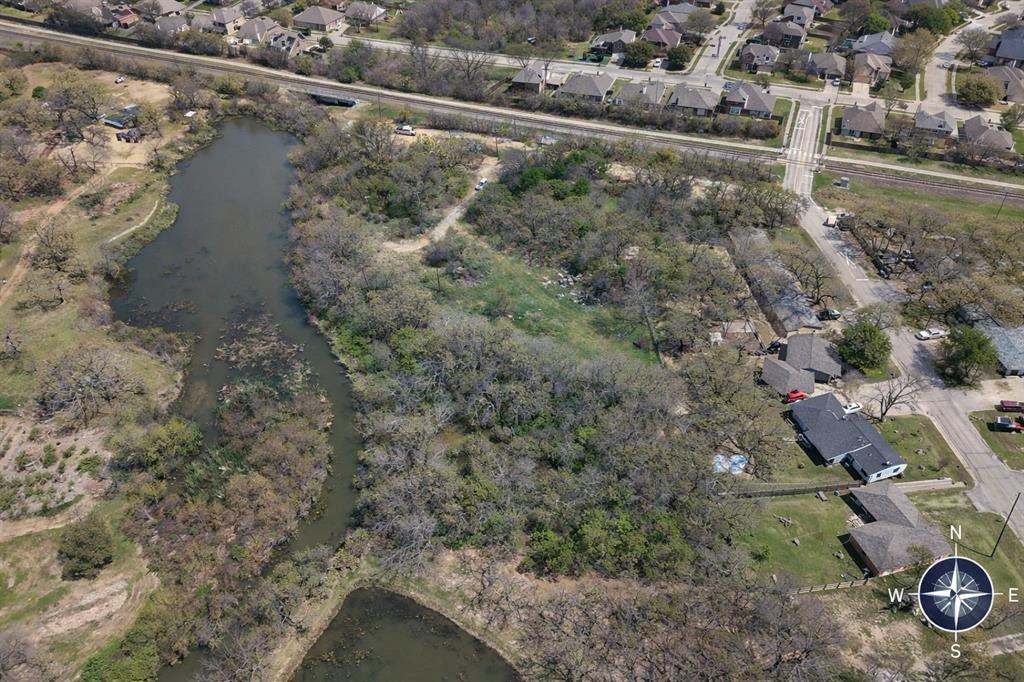 Tbd Burl Street Corinth, TX 76208 - Photo 3 of 11 a view of a forest with a lake view