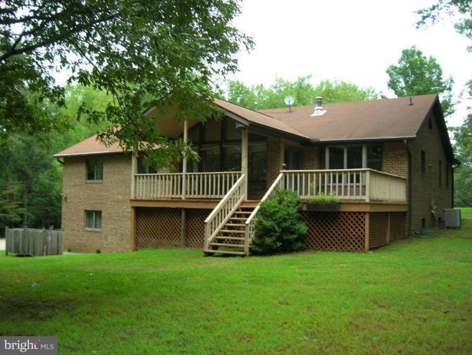 7151 Marshall Road St. Leonard, MD 20685 - Photo 1 of 25 a view of house with a swimming pool