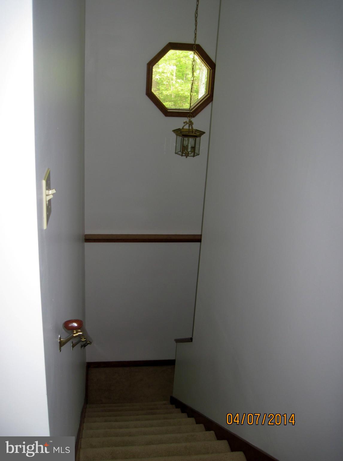 7151 Marshall Road St. Leonard, MD 20685 - Photo 12 of 25 a bathroom with a sink and mirror