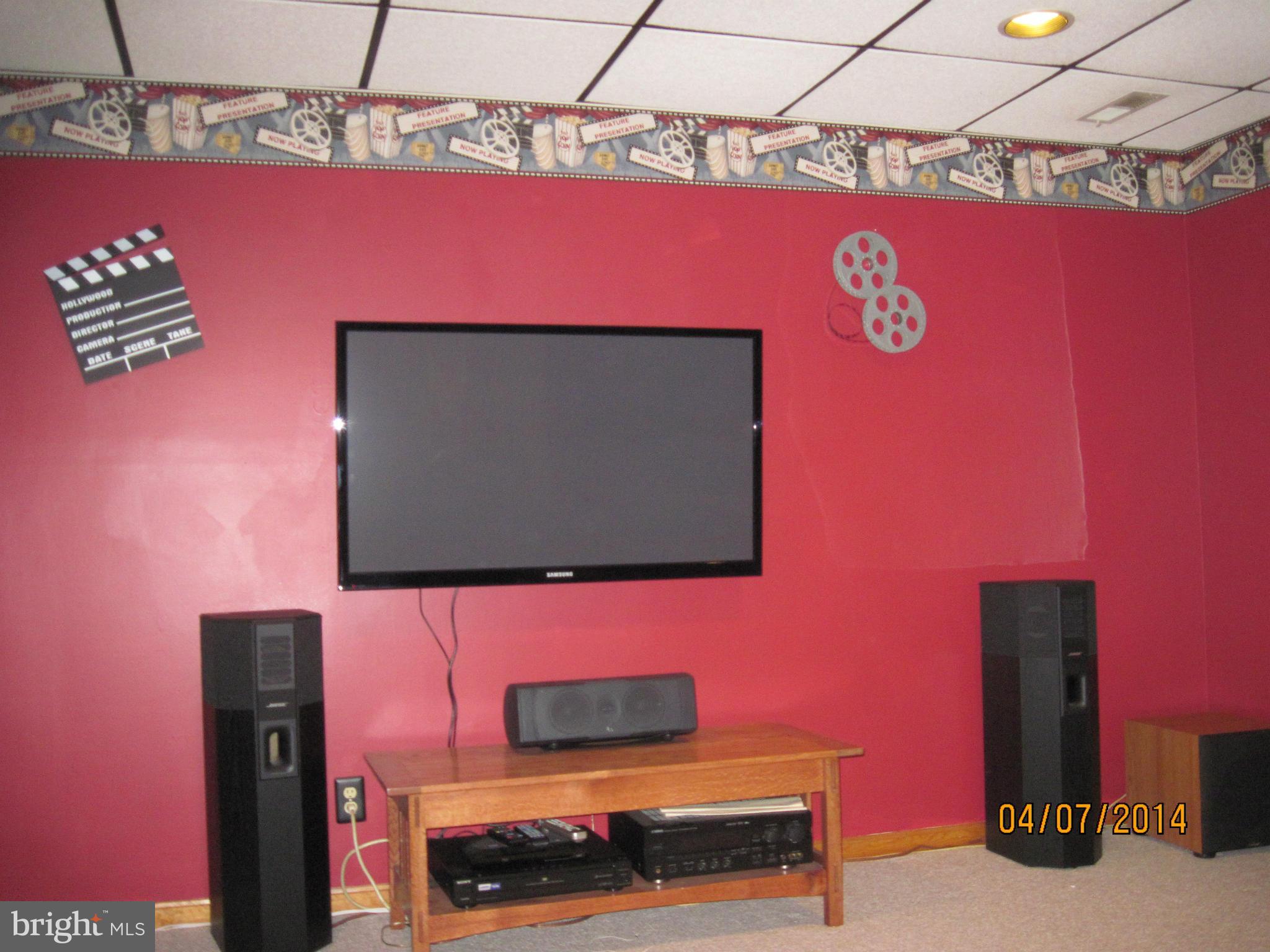 7151 Marshall Road St. Leonard, MD 20685 - Photo 20 of 25 a living room with a flat screen tv and a wall painting