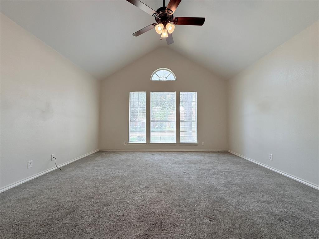 313 Pear Tree Place Denton, TX 76207 - Photo 11 of 23 Unfurnished room with carpet, ceiling fan, and high vaulted ceiling