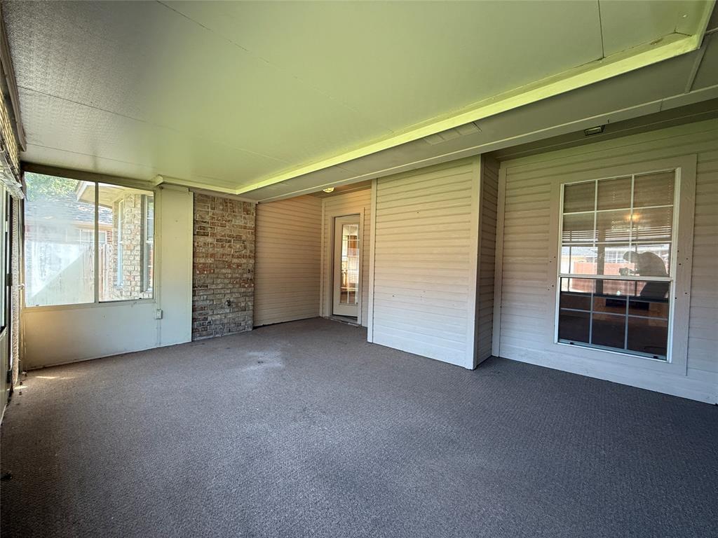 313 Pear Tree Place Denton, TX 76207 - Photo 23 of 23 Unfurnished sunroom with a patio area