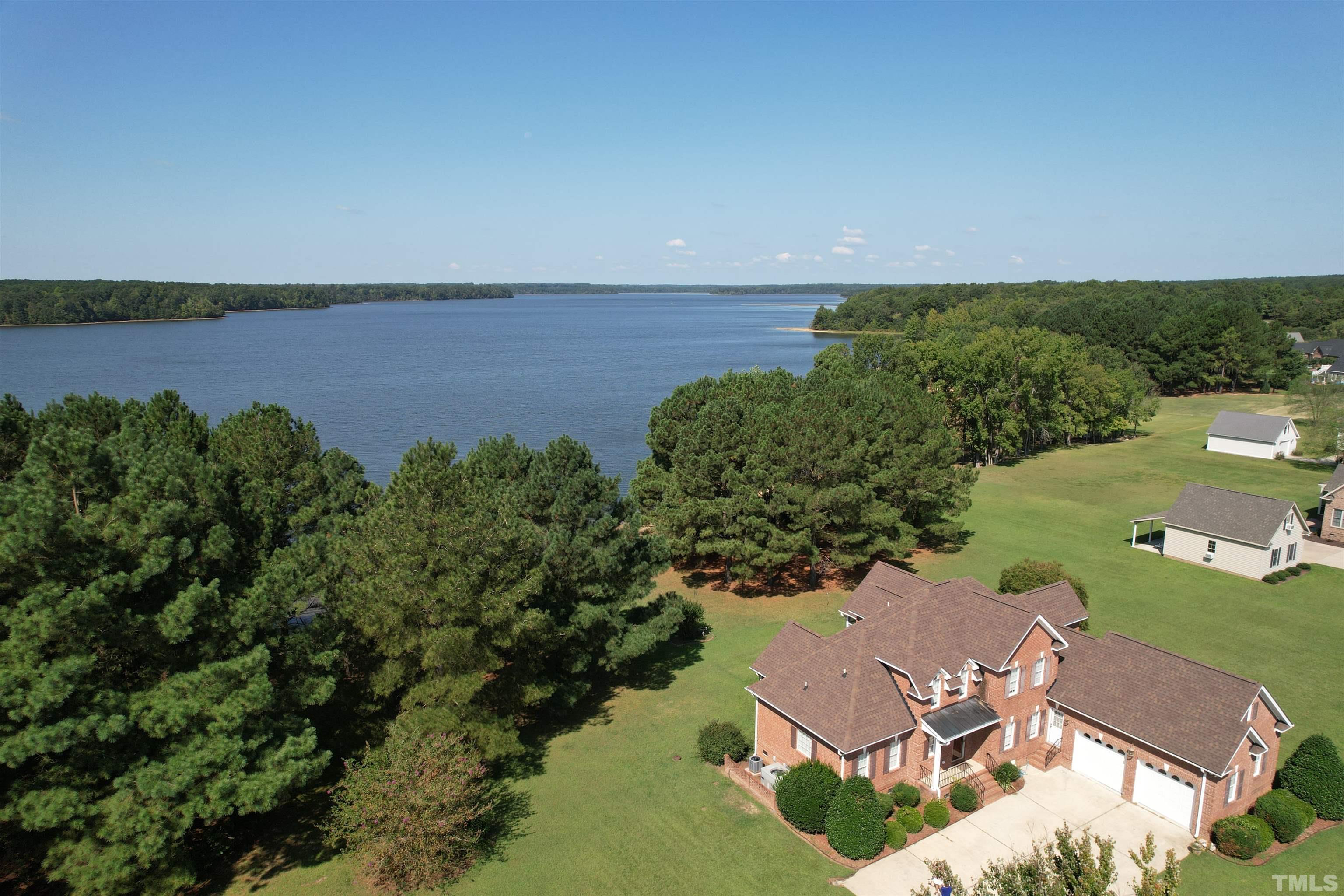 8666 Bailey Road Sims, NC 27880 - Photo 11 of 35 an aerial view of a house with a yard and lake view
