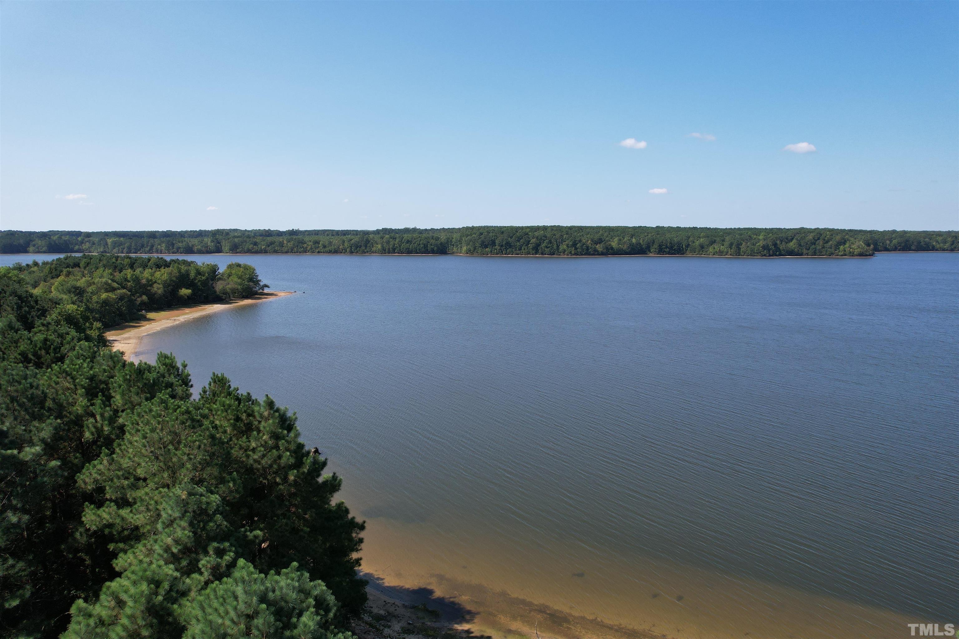 8666 Bailey Road Sims, NC 27880 - Photo 13 of 35 a view of a lake from a yard