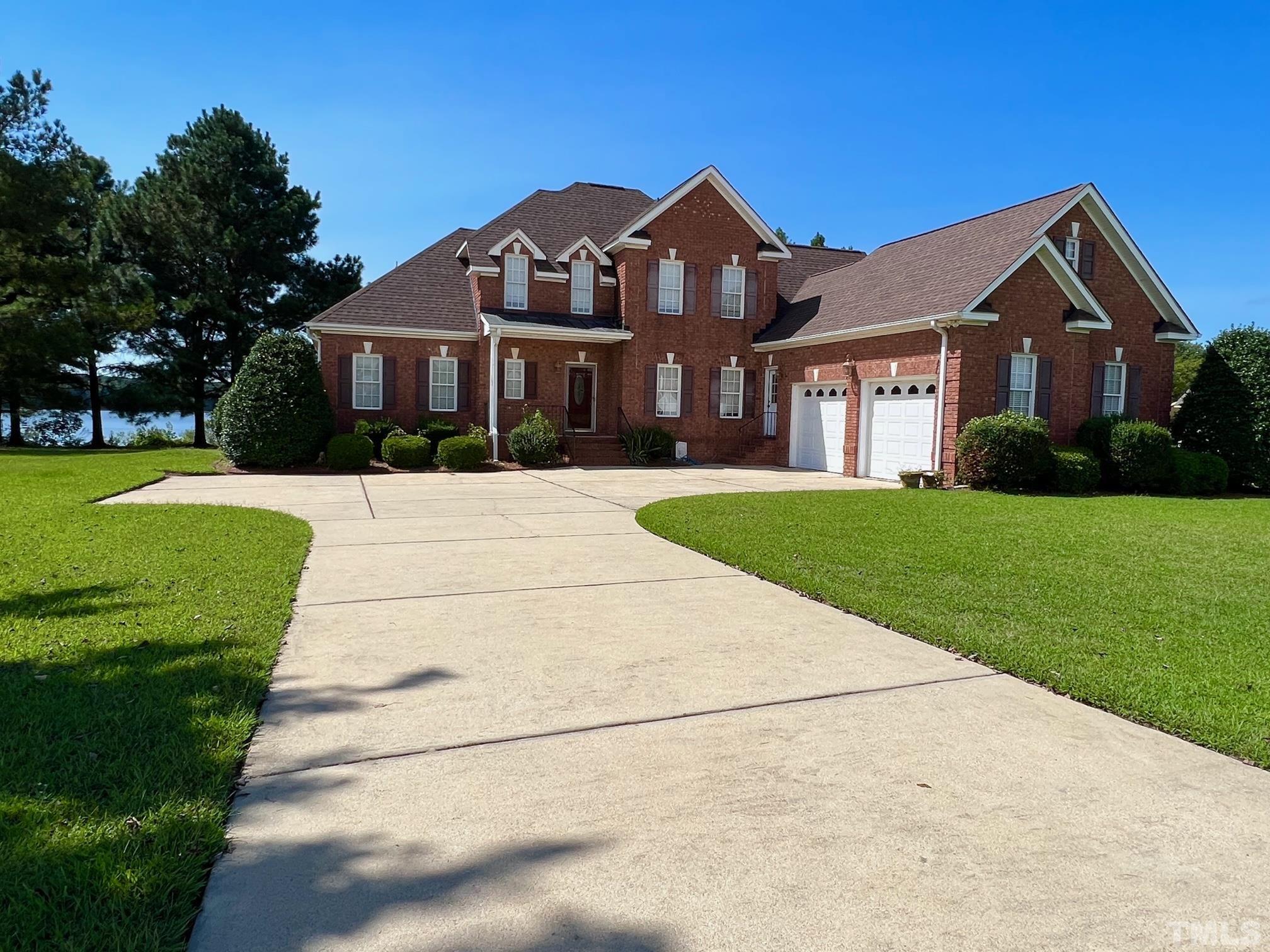 8666 Bailey Road Sims, NC 27880 - Photo 2 of 35 a front view of a house with a yard